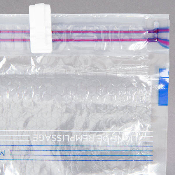 A clear plastic bag with red and blue lines.