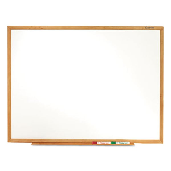 A Quartet melamine whiteboard with an oak finish.