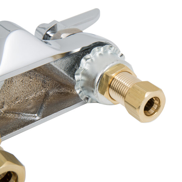 A chrome T&S deck-mounted faucet with lever handles.