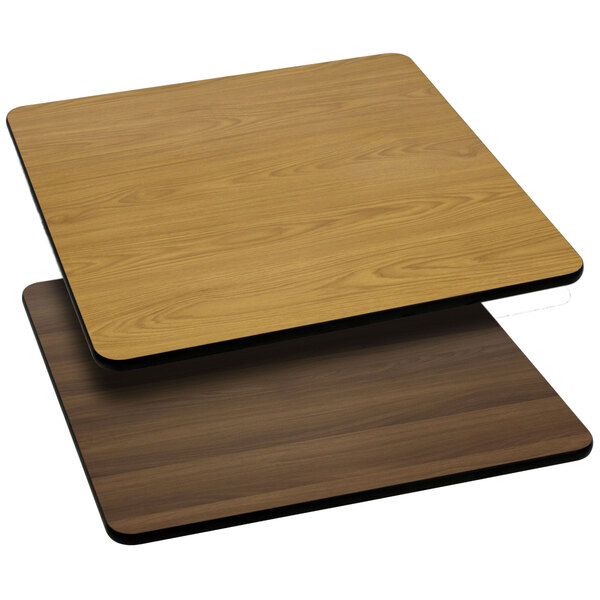 A close-up of a Flash Furniture natural and walnut laminated wood table top with a square pattern.