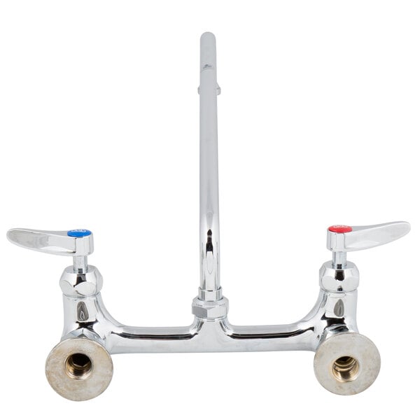 A close-up of a chrome T&S wall mount faucet with lever handles.