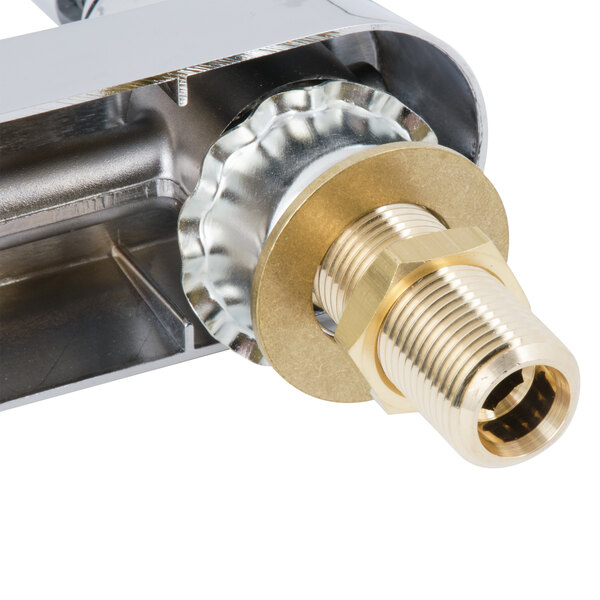 The brass lever handles of a T&S wall mounted workboard faucet.