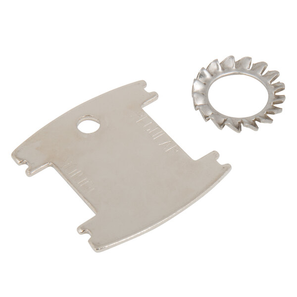 A close-up of a T&S wall mounted faucet with a metal ring on the lever handles.