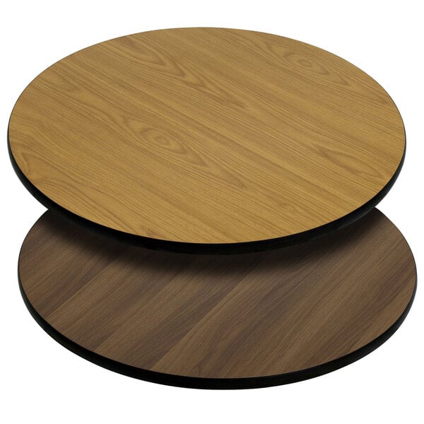 A Flash Furniture round table top with a natural and walnut wood surface.