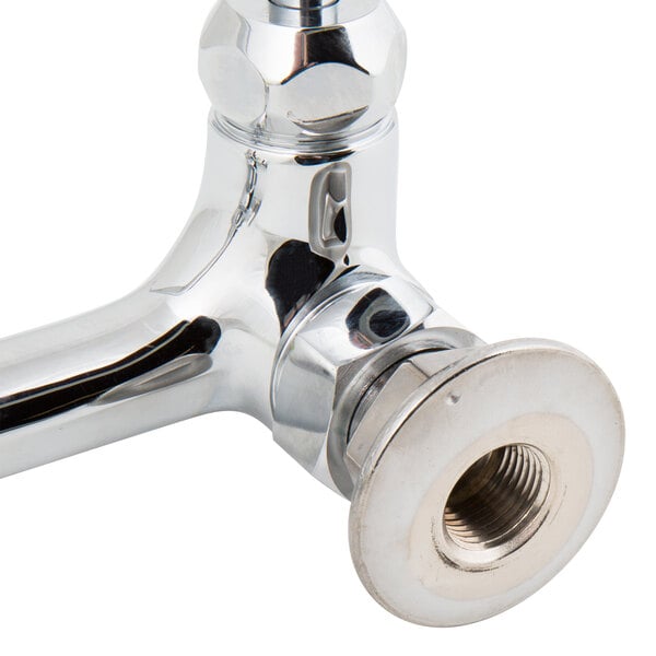 A T&S chrome wall mounted faucet with lever handles.