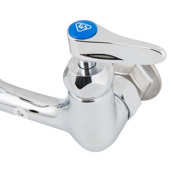 A chrome T&S wall mount faucet with lever handles.