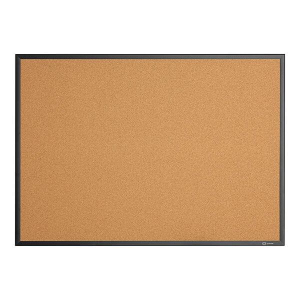 A close-up of a Quartet cork board with black trim.