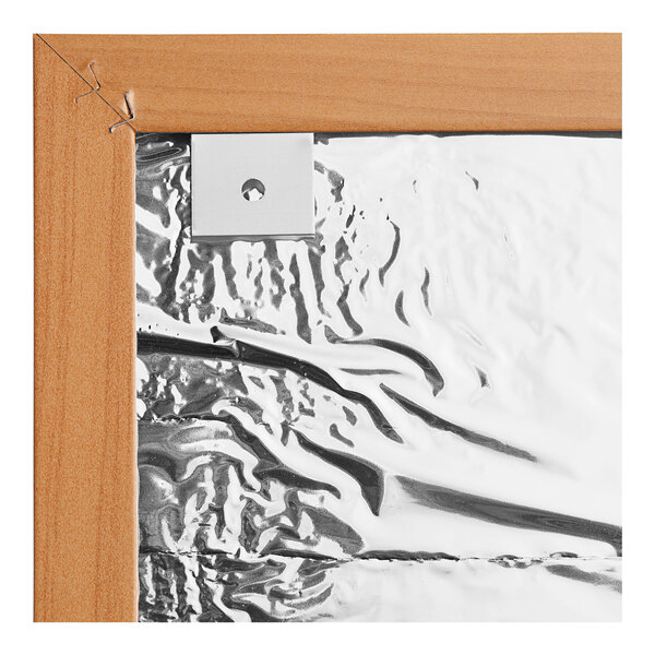 A white rectangular cork board with an oak frame.