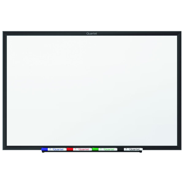 A Quartet whiteboard with a black frame.