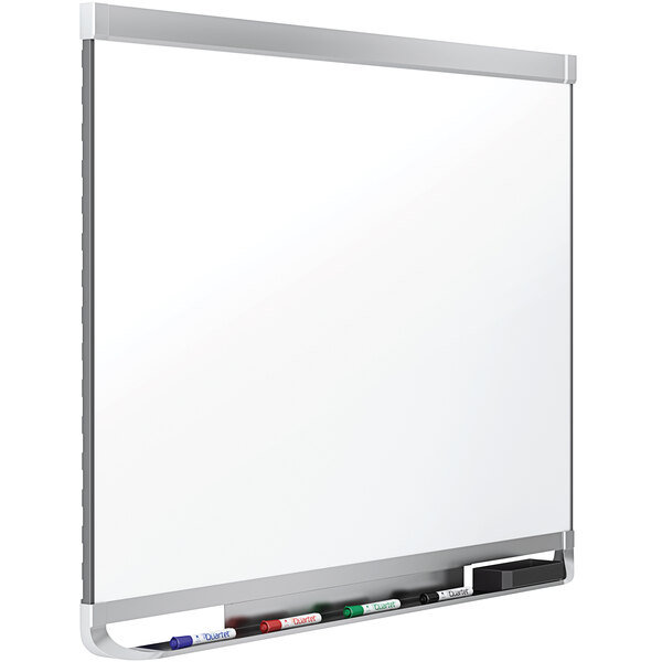 A Quartet magnetic porcelain whiteboard with a black marker and holder.