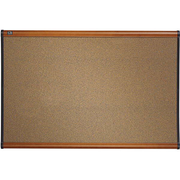 A Quartet cork board with a cherry plastic frame.