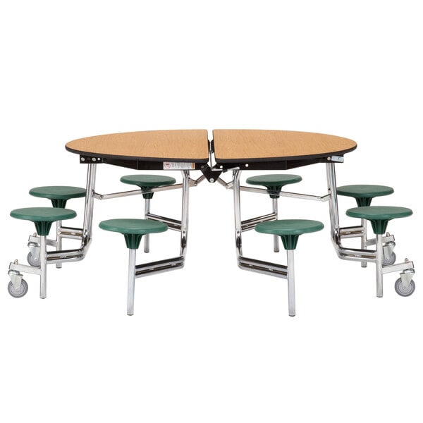 A National Public Seating round cafeteria table with green MDF seats on metal legs.