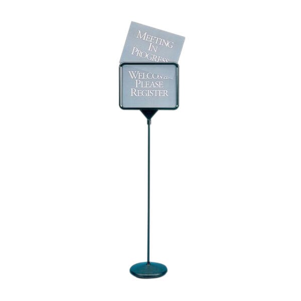 A black metal Quartet pedestal stand with an 11" x 14" sign on it.