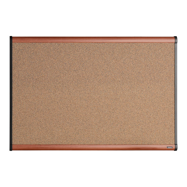 A Quartet cork board with a cherry plastic frame.