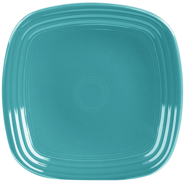 A blue square Fiesta® luncheon plate with a white center.