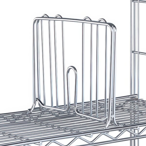 A Metro chrome wire shelf divider on a metal shelf.