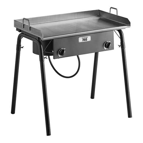 A Backyard Pro double burner outdoor range with a griddle plate on a table.