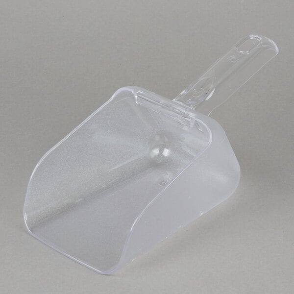 A clear plastic Rubbermaid Bouncer scoop with a handle.
