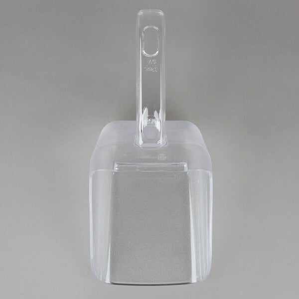A clear plastic Rubbermaid Bouncer scoop with a clear lid.