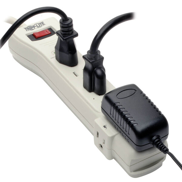 A close-up of a Tripp Lite 7-outlet surge protector.
