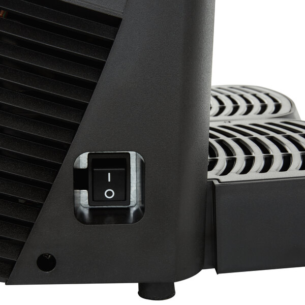 A Crathco refrigerated beverage dispenser with fruit decal on the front.