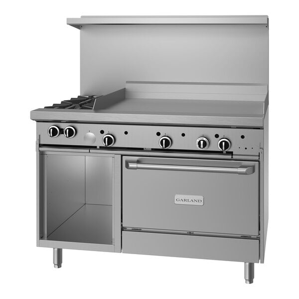 A large stainless steel Garland commercial range with two burners, a griddle, and storage.