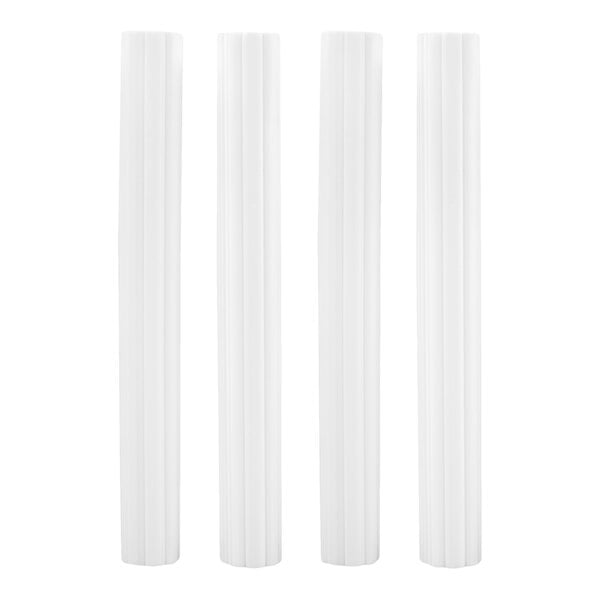 Four tall, white, cylindrical objects with vertical grooves, standing upright in a row against a white background.