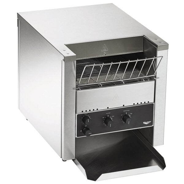 A stainless steel Vollrath conveyor toaster on a counter.
