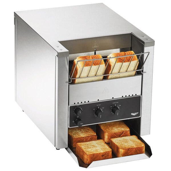 A Vollrath conveyor toaster with bread inside.