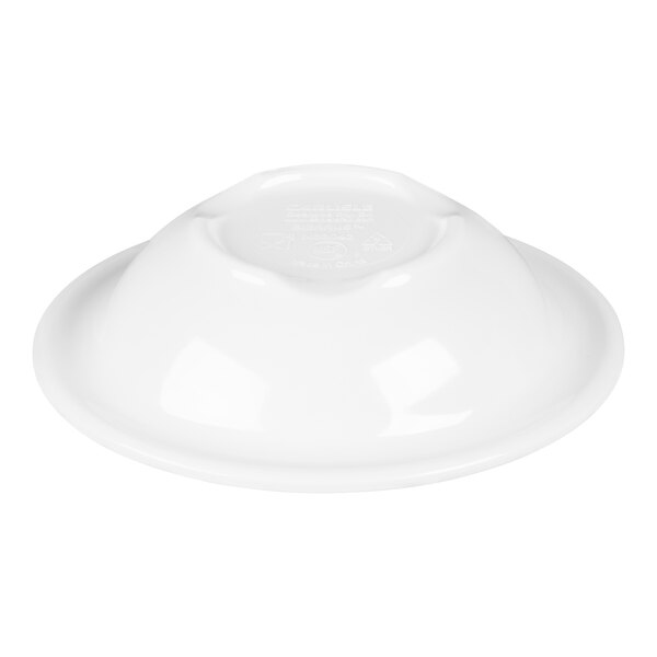 A white rimmed melamine fruit bowl turned upside down.