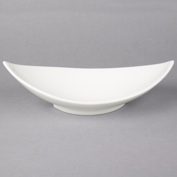 A white bowl with a curved edge on a gray background.