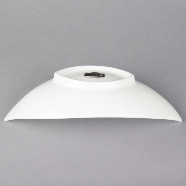 A white bowl with a lid on top.