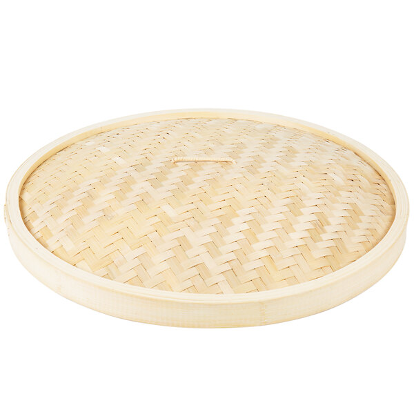 A Town bamboo steamer cover with a woven pattern.