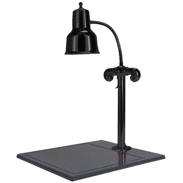 A Hanson Heat Lamps black carving station lamp on a black synthetic granite base.