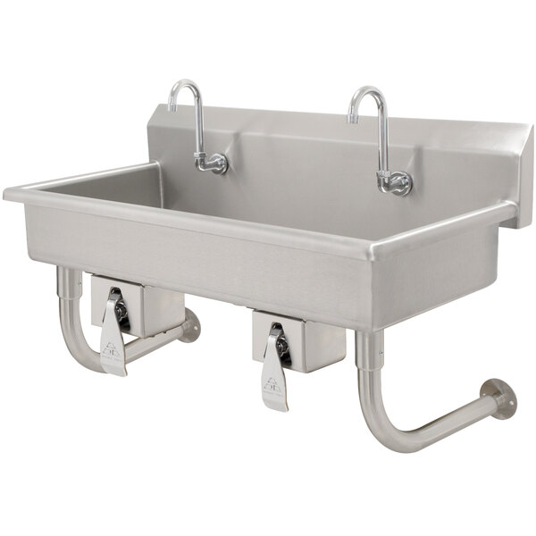 An Advance Tabco stainless steel multi-station hand sink with knee operated faucets.