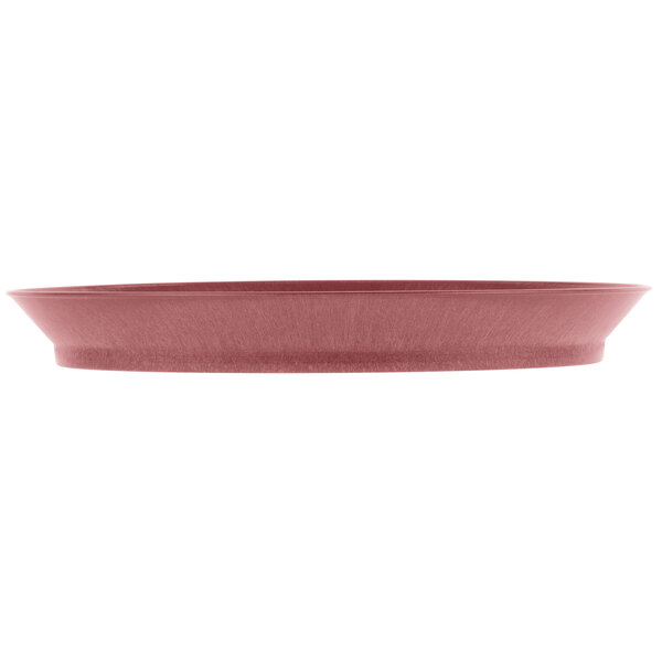 A raspberry polypropylene oval deli server with a short base.