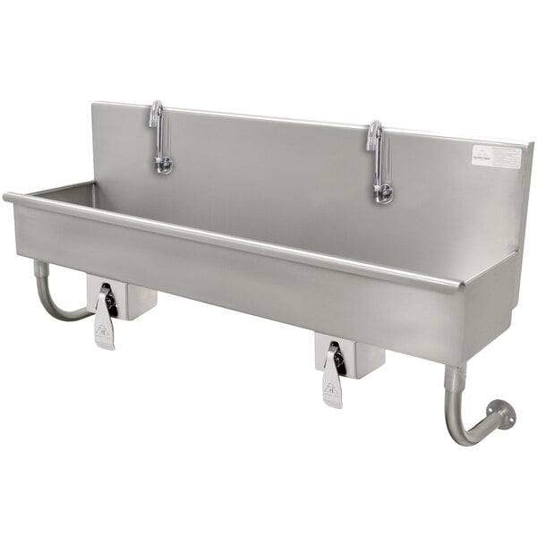 A stainless steel Advance Tabco hand sink with knee operated faucets.