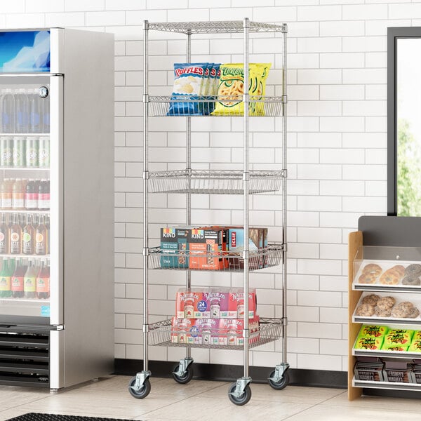 A Regency wire shelving unit with snacks on the shelves in a convenience store.