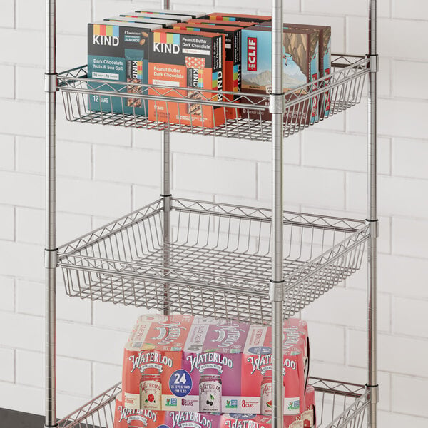 A Regency chrome shelf basket holding boxes on a shelf.