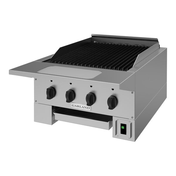 A stainless steel 24-inch natural gas radiant charbroiler with four control knobs and a grill surface.