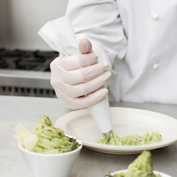 Chef using a polyester pastry bags to pipe mashed potatoes