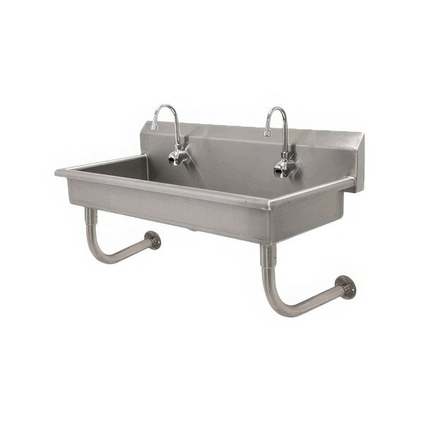 An Advance Tabco stainless steel multi-station hand sink with four electronic faucets.