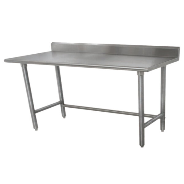 A stainless steel Advance Tabco work table with a backsplash.
