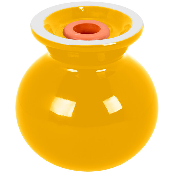 A yellow vase with a white rim and white squares on top.