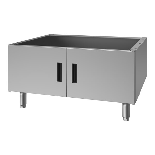 A stainless steel charbroiler cabinet with two front doors and four legs.