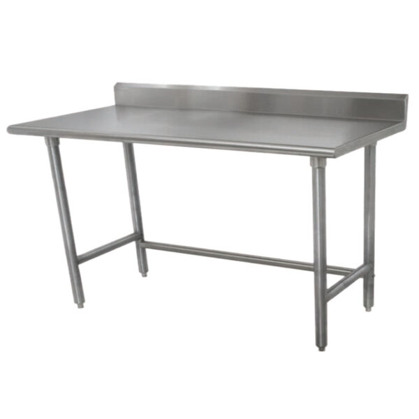 An Advance Tabco stainless steel work table with a backsplash.