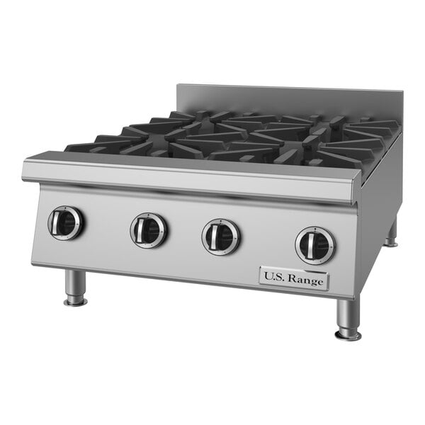 A stainless steel countertop range with four heavy-duty burners and control knobs.