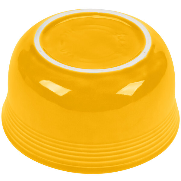 A yellow bowl with a white rim.