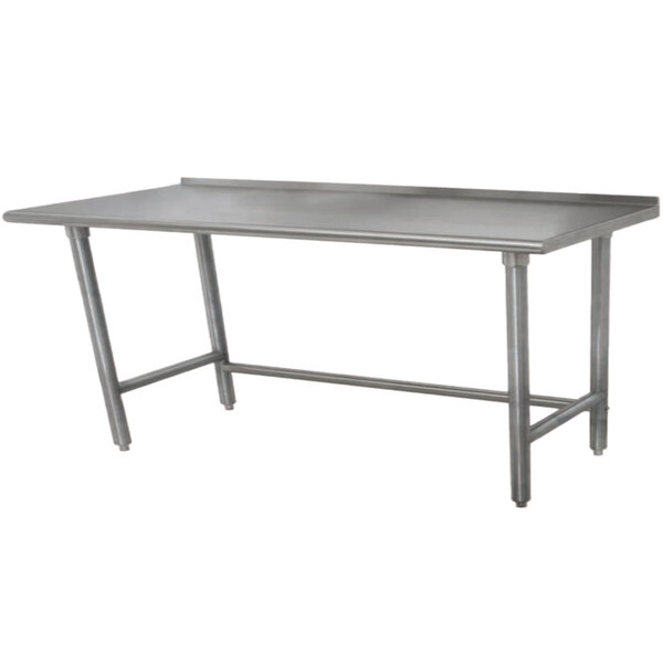A stainless steel Advance Tabco work table with legs.