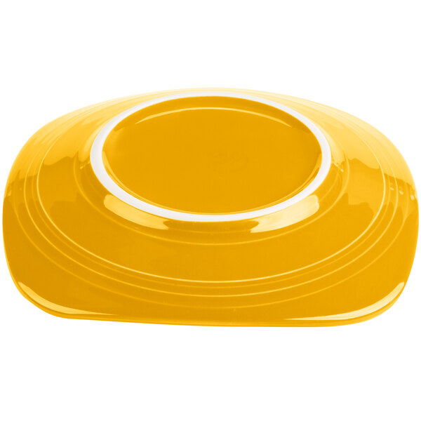 A yellow Fiesta® salad plate with a white rim.
